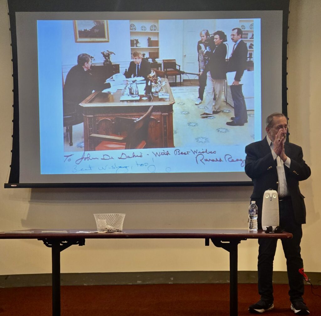 John DeDakis, who served as a White House correspondent during Ronald Reaganβs presidency, shared a signed photo by the president of him in action