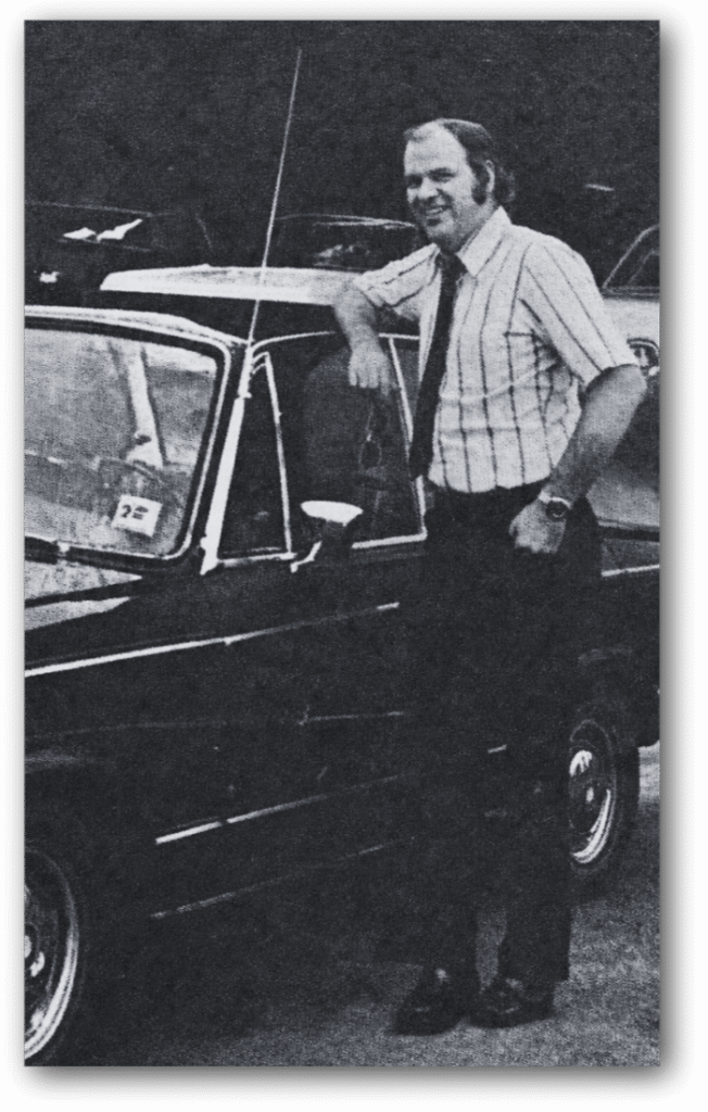 Marty and his maroon mid-1970s BMW model 2002 TII sportssedan. — Photo courtesy of Hot Copy, Throop, PA. Reprinted with permission of Larry Sparano, Editor & Publisher.